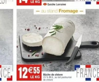 on  Büche de chèvre LE KG 23% MG, au lait pasteurise  de chèvre  Quiche Lorraine  au stand Fromage -  FRANCE 